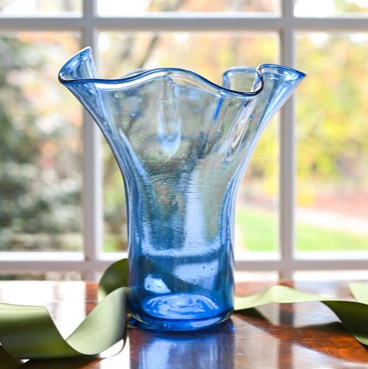 Blue glass vase with a wavy design