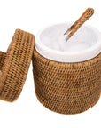 Wicker basket with a white interior and wooden handle on a white background