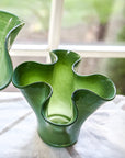 Top view of a green glass vase shaped like a lettuce leaf