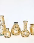 A collection of five hand-blown glass vases with 14k gold leaf detailing, varying in size and shape, displayed against a white background.