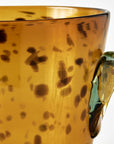 Glass bucket with brown speckled pattern and clear handle on a white background