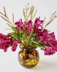 Vase with pink flowers and green leaves on a white background