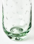Clear glass with star pattern on a white background