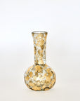 A hand-blown glass vase with 14k gold leaf pattern, featuring a narrow neck and a round body.