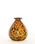 A hand-blown, brown tortoise glass vase with a spotty pattern, displayed against a neutral background.