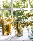Four glass vases with two fully covered in 14k gold leaf, and the other covered only in the rim, in various sizes