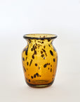A brown glass vase with a tortoise shell pattern design.