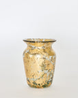 A hand-blown glass vase with 14k gold leaf detailing, featuring a tall, slender shape with a reflective surface.