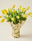 14k gold covered textured vase filled with yellow tulips
