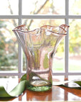 Pink glass sculptured vase with a wavy design