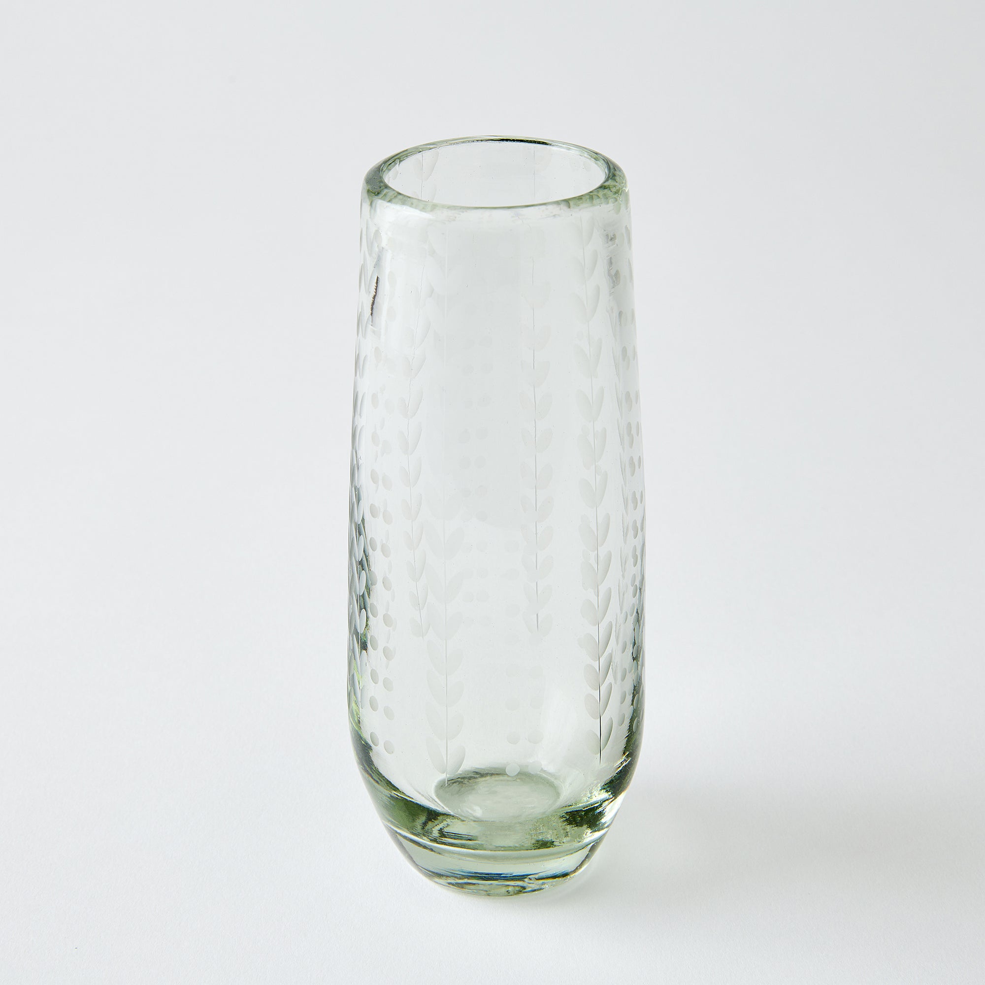 Clear glass with etched ferns and dots on a white background