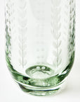 Clear glass with etched dots and ferns design on a white background