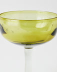 Yellow margarita glass with star patterns on a white background