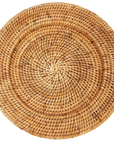 Round woven placemat on a white background