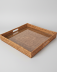 Woven rattan tray on a white background