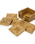 Set of woven baskets and coasters on a white background