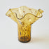 Brown glass vase with textured surface on a white background