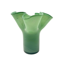 A green, mouth-blown glass vase with an abstract, leaf-like shape, handmade and recycled.
