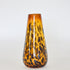 A hand-blown, brown glass vase with a tortoise shell pattern design.