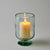 Candle in a clear starry candleholder on a gray background