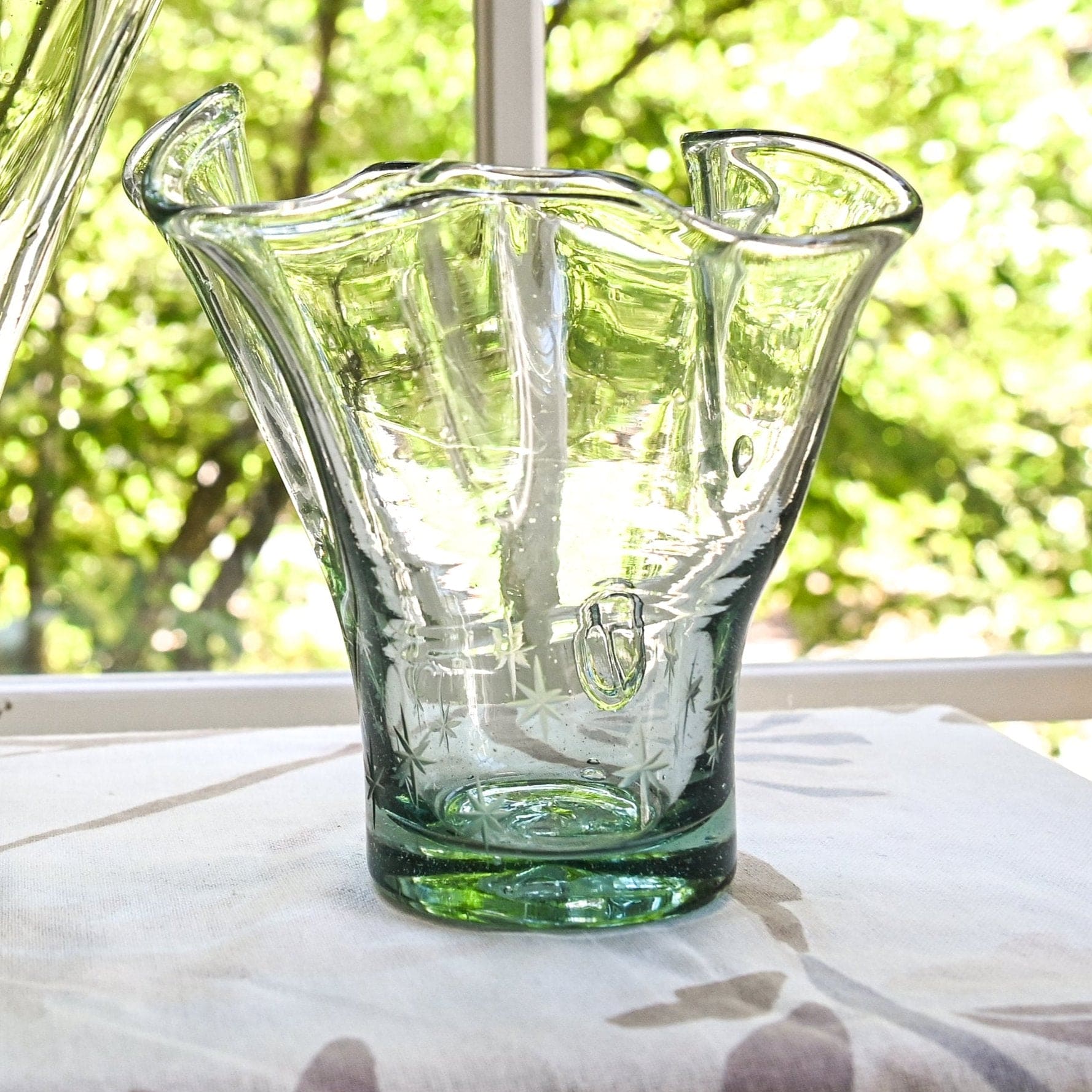 Clear glass vase with star etchings