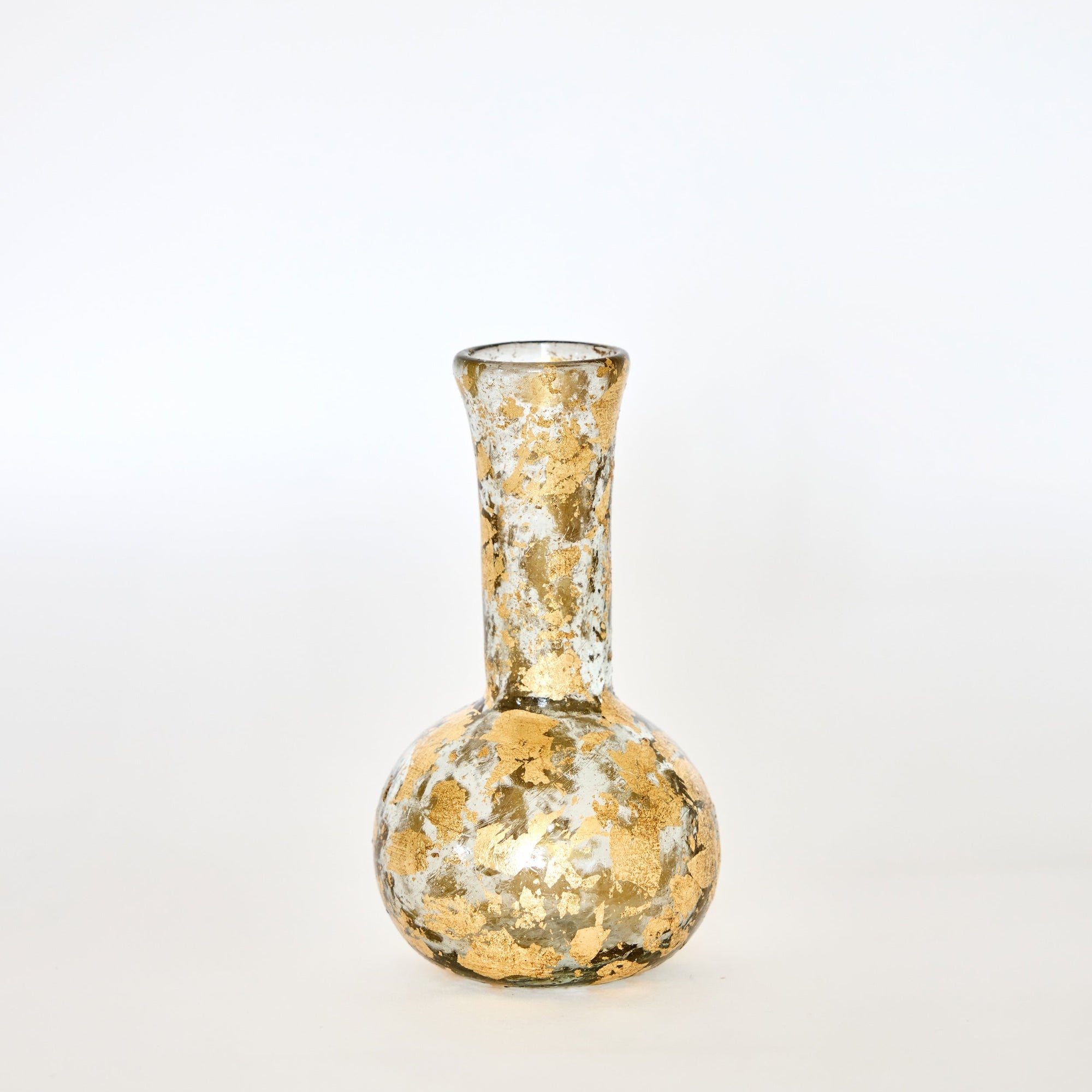 Decorative glass vase with gold speckles on a white background