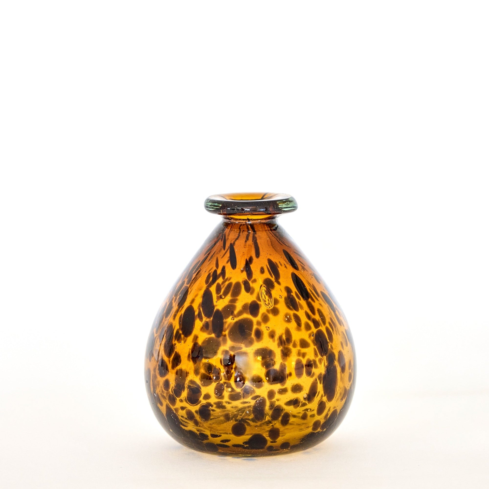 A hand-blown, brown tortoise glass vase with a spotty pattern, displayed against a neutral background.