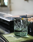 Decorative rocks glass on a kitchen counter with a blurred background