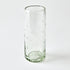 Clear glass tumbler with star patterns on a white background