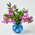 Blue glass vase with pink flowers on a white background