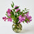 Olive colored glass vase with pink flowers on a white background