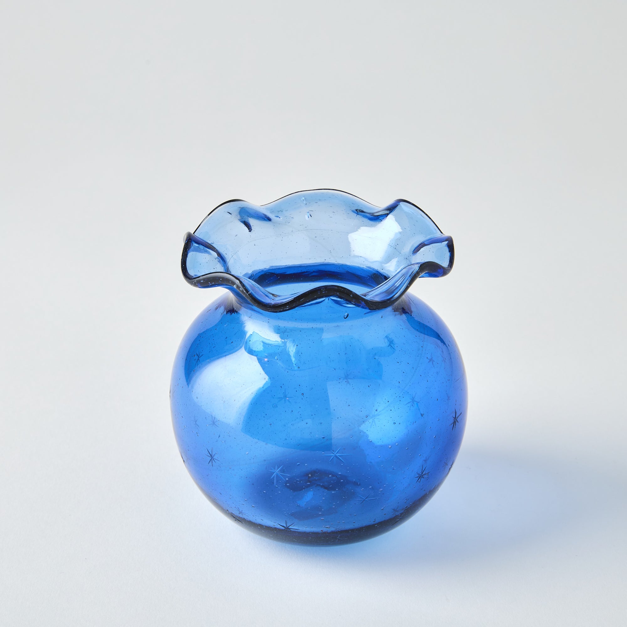 Close-up of the Starry Night Pomegranate Vase (Blue) against a neutral backdrop, focused on texture and detail.