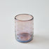 Glass candle holder with heart pattern on a white background