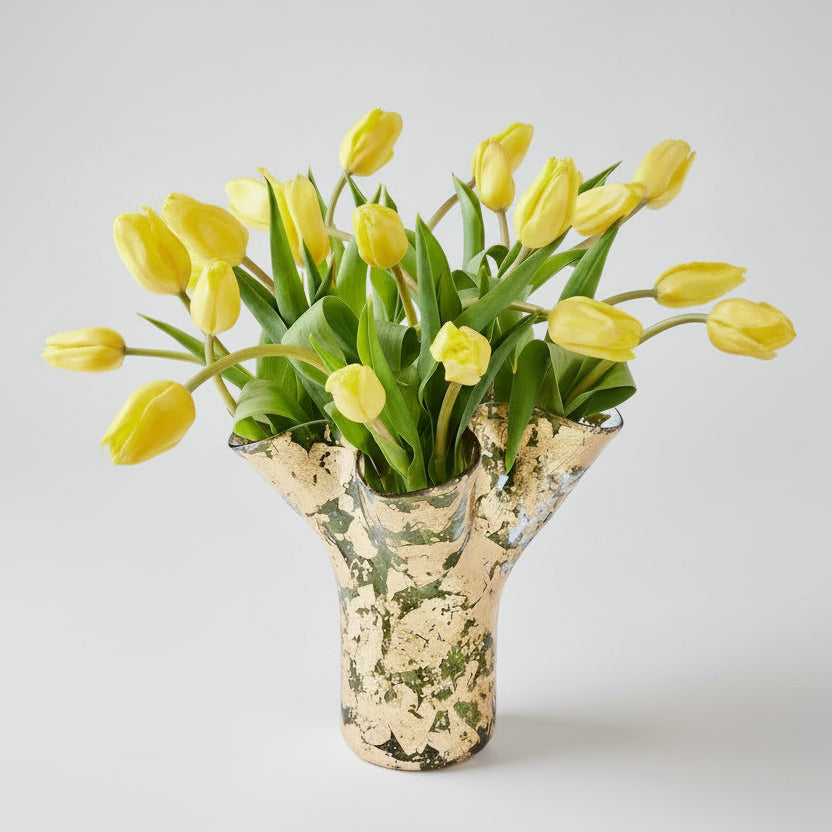 14k gold covered textured vase filled with yellow tulips