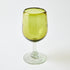 Green wine glass on a white background