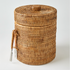 Woven basket with a lid on a white background