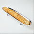 Long metal tray with crackers on a white background