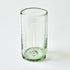 Clear glass tumbler with a textured base on a white background
